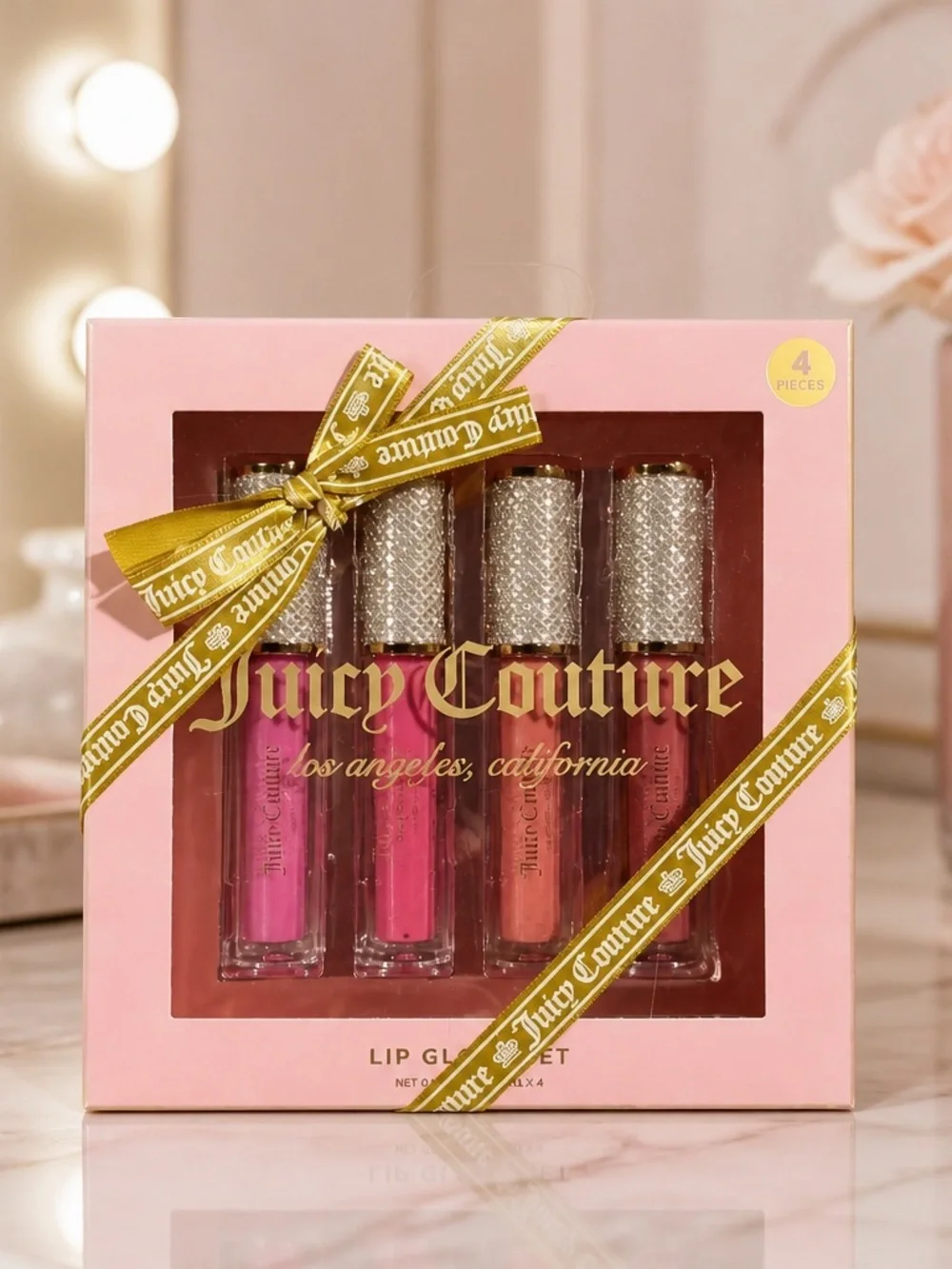 Juicy Couture 4-Piece Lip Gloss Set – Pink & Nude Shades